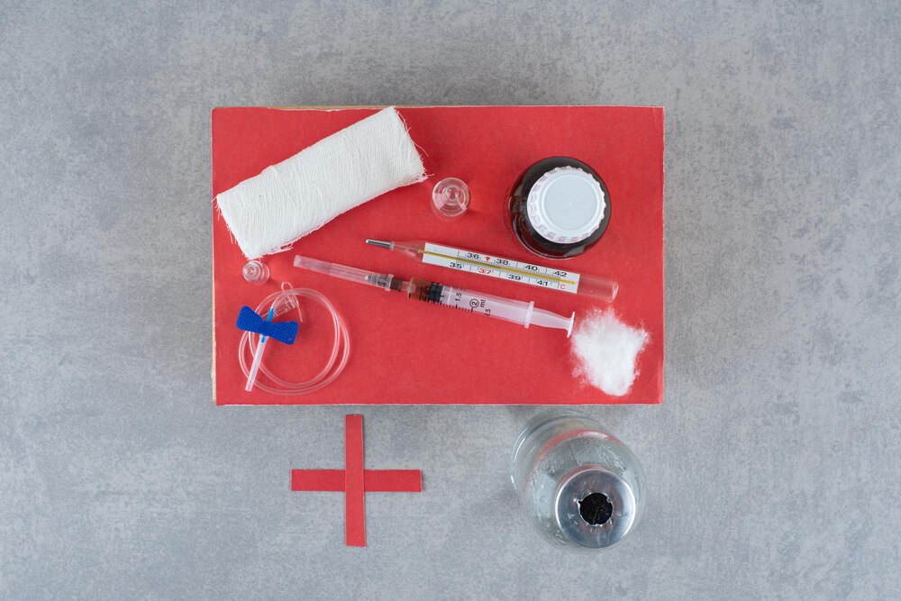Medicines with syringe on gray