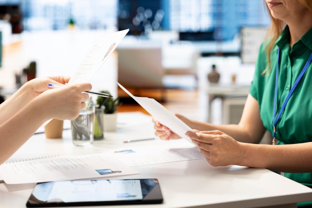 HR staff member reviewing candidate asking questions about qualifications
