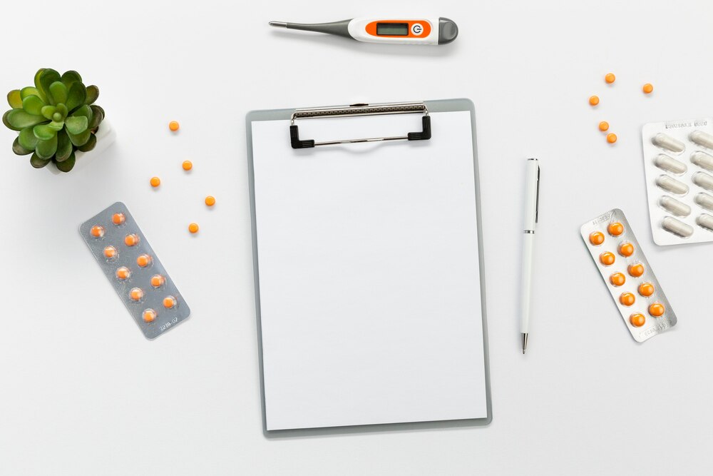Clipboard with pills beside